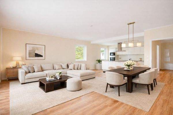 Großzügiges Wohnzimmer mit offener Einbauküche (Visualisierung)