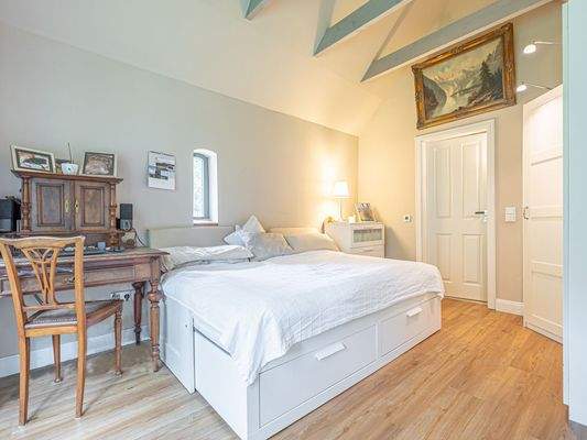 Schlafzimmer mit Bad en Suite im Backhaus