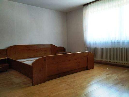 Schlafzimmer mit Holzboden