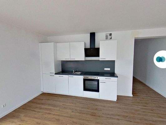 Ansicht III: Wohn- und Esszimmer mit offenem Küchenbereich