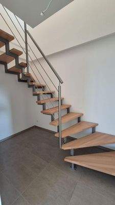 Treppe zum oberen Geschoss