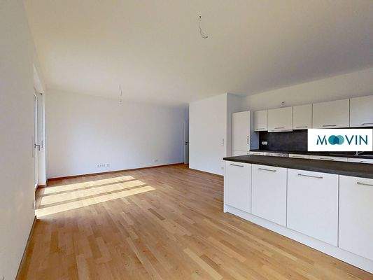 Ansicht III: Wohn- und Esszimmer mit offener Küche