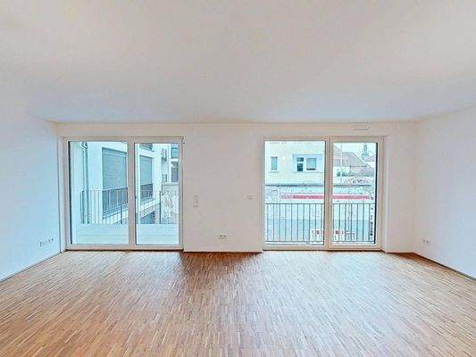 Ansicht II: Wohn- und Esszimmer mit offenem Küchenbereich