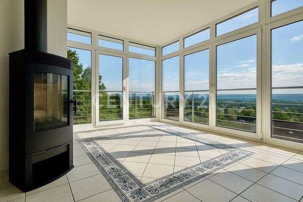 Der Wintergarten mit Kamin und sensationellem Ausblick