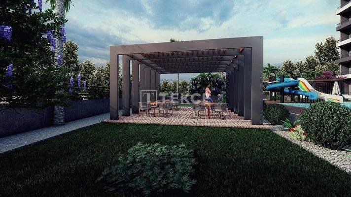 New Apartments in Mersin with a Pool and Modern Landscaping