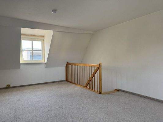 Schlafzimmer mit Treppenaufgang