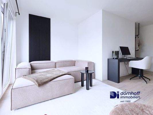 Wohnzimmer mit offener Küche