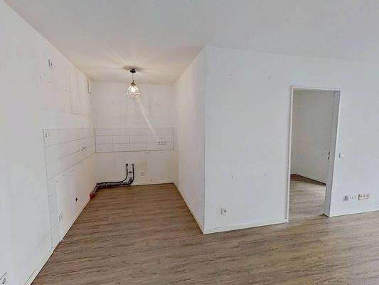 Ansicht III: Wohn- und Esszimmer mit offenem Küchenbereich