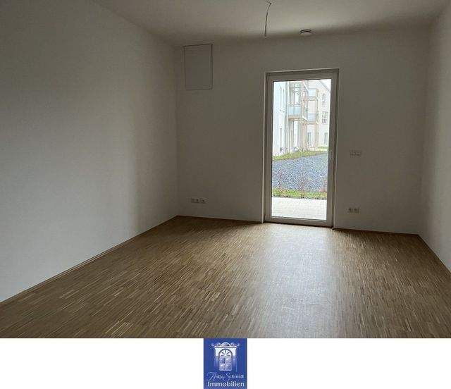 Lieblingsplatz mit attraktiver Ausstattung, moderner EBK und Terrasse im Erstbezug! - Photo 1