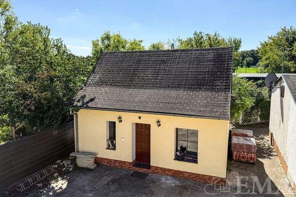 Blick von der Dachterrasse zum Wirtschaftshaus