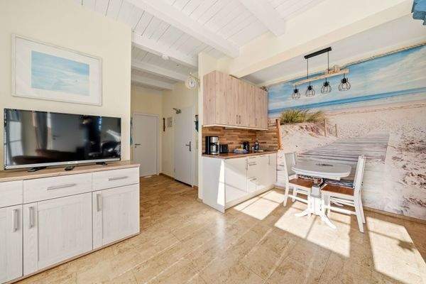 Wohnzimmer mit integrierter Küche & Essbereich