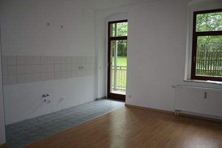 Wohnzimmer mit offener Küche