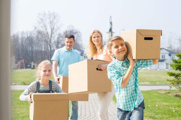 bigstock-Family-with-cardboard-boxes-mo-92262542.j