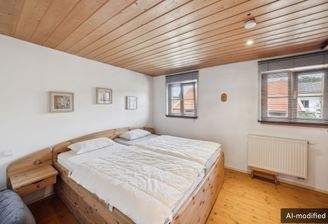 Helles Schlafzimmer mit warmen Holzelementen und gemütlicher Atmosphäre