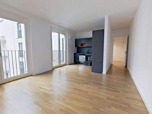 Ansicht III: Wohn- und Esszimmer mit offenem Küchenbereich