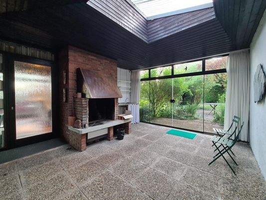 Wintergarten mit Kamin