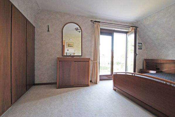 Schlafzimmer mit Balkonzugang