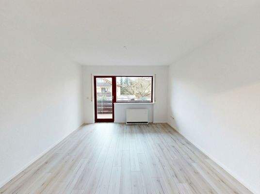 Wohnzimmer mit Zugang zum Balkon