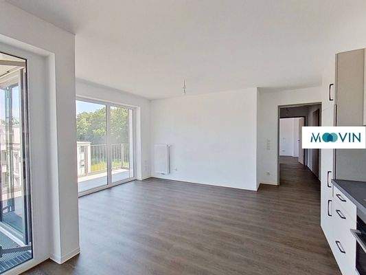 Ansicht III: Wohn- und Esszimmer mit offenem Küchenbereich