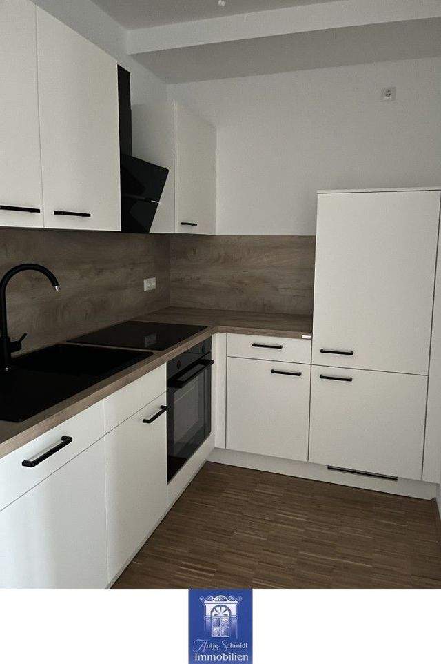 Gemütliche und hochwertige Neubauwohnung mit Balkon, EBK und Fußbodenheizung! - Photo 2