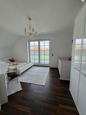 Schlafzimmer mit Balkon