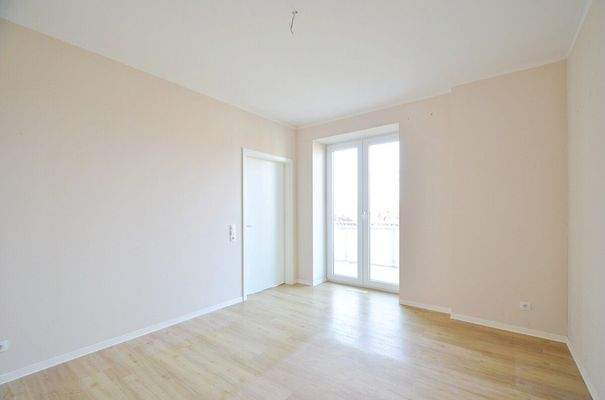 Schlafzimmer mit Balkonzugang