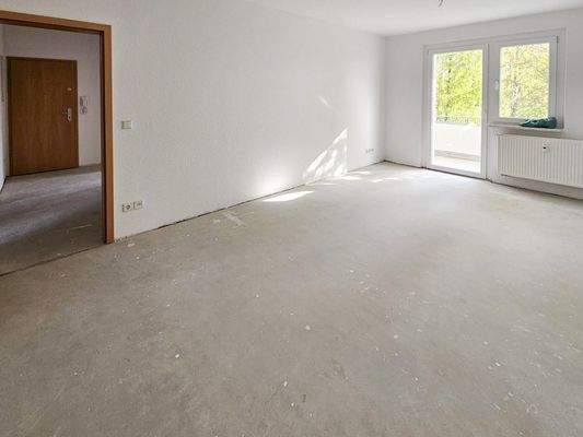 Wohnzimmer mi Balkonzugang