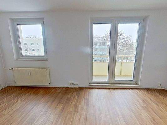 Ansicht II: Wohn- und Esszimmer mit offenem Küchenbereich