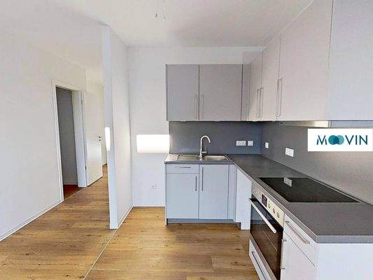 Ansicht IV: Wohn- und Esszimmer mit offenem Küchenbereich