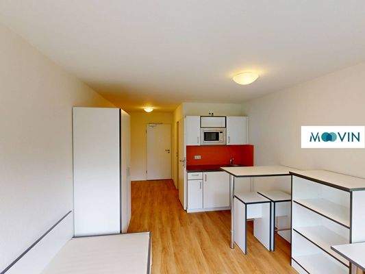 Ansicht V: Wohn- und Schlafzimmer mit offenem Küchenbereich