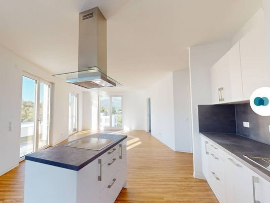 Ansicht I: Wohnzimmer mit offenem Küchenbereich