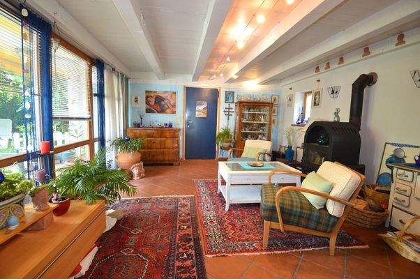 Wintergarten mit Holzofen