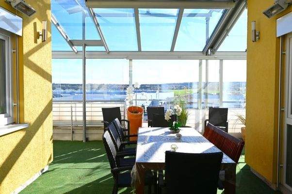 Wintergarten mit Sitzbereich