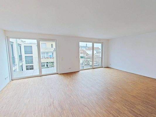 Ansicht III: Wohn- und Esszimmer mit offenem Küchenbereich