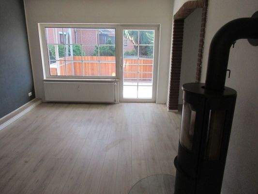 Raum 3 Wohnzimmer mit Kaminofen 