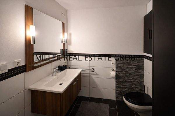 Badezimmer im Apartment im Kellergeschoss