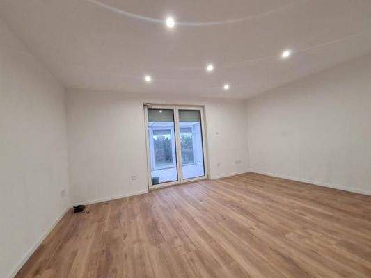 Foto 7_Wohnzimmer-Wintergarten.JPG