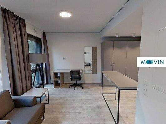 Ansicht III: Wohn- und Schlafzimmer mit offenem Küchenbereich