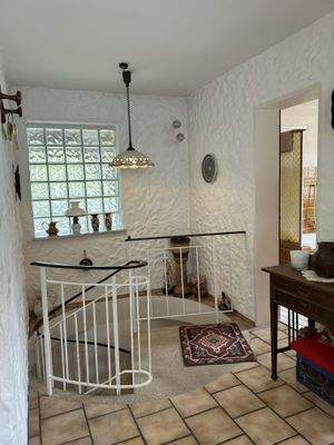 Hauptwohnung: Wendeltreppe zum Untergeschoss