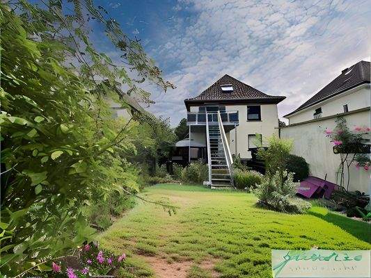 Rückansicht mit Gemeinschaftsgarten