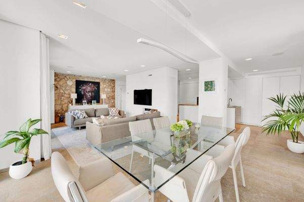 Dining area and living area in apartment in Portals Nous