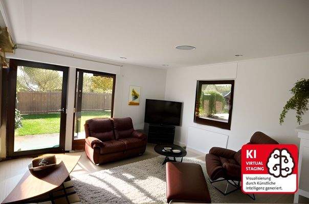 Wohnzimmer mit Zugang zur Terrasse im EG