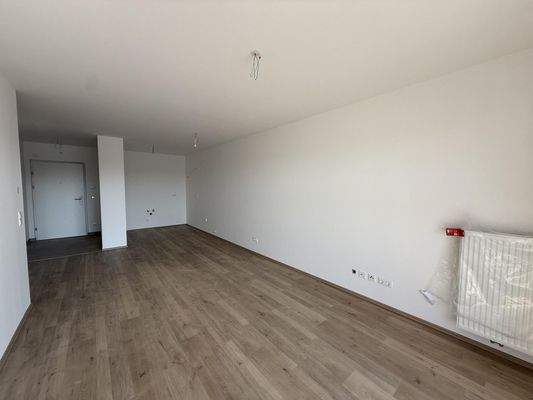 Haus_1_Top_14_Wohnbereich_mit_Blick_auf_Küche_