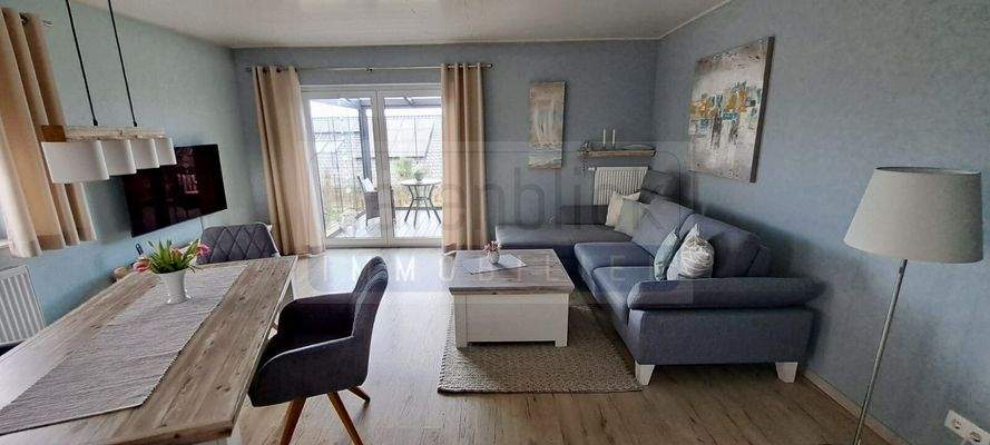 Wohnzimmer mit Wintergarten