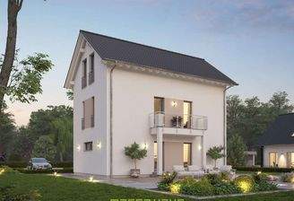 Dieses massa haus Fertighaus Einfamilienhaus im Lifestyle-Design präsentiert sich bei Abenddämmerung