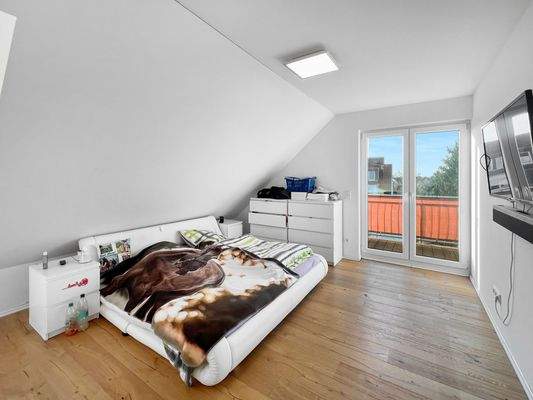Schlafzimmer mit Balkonzugang
