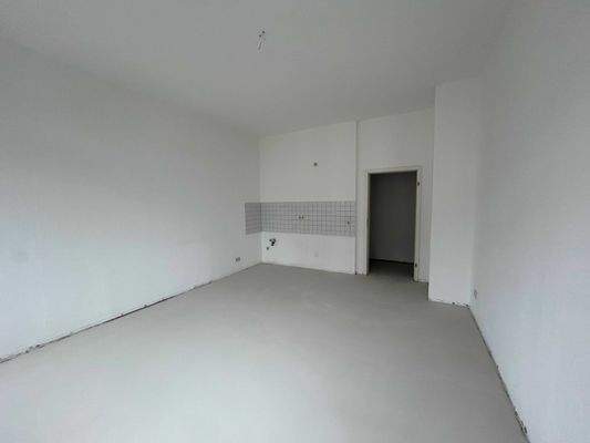 Wohnzimmer mit Blick auf den Kochbereich