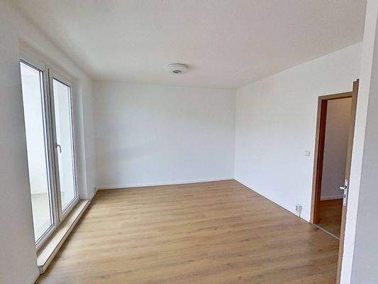 Ansicht II: Wohn- und Esszimmer mit offenem Küchenbereich