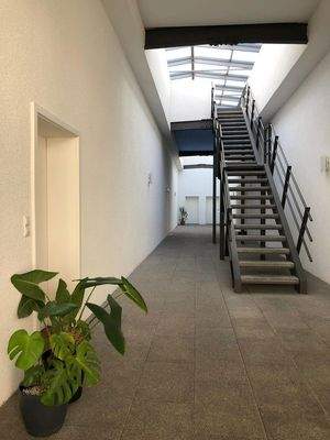 Atrium als Zugang zur Wohnung