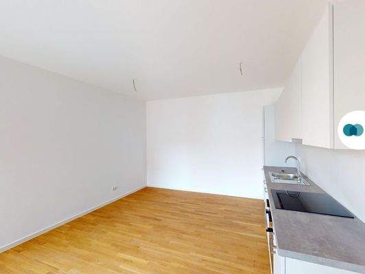 Ansicht I: Wohn- und Esszimmer mit offenem Küchenbereich